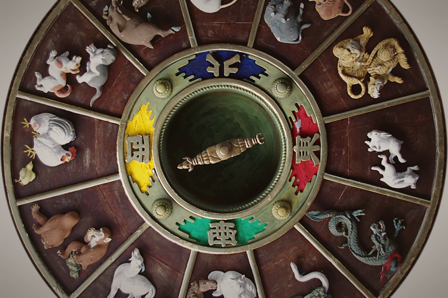 A real cultural carving of the twelve Chinese zodiac animals arranged in a circular composition.